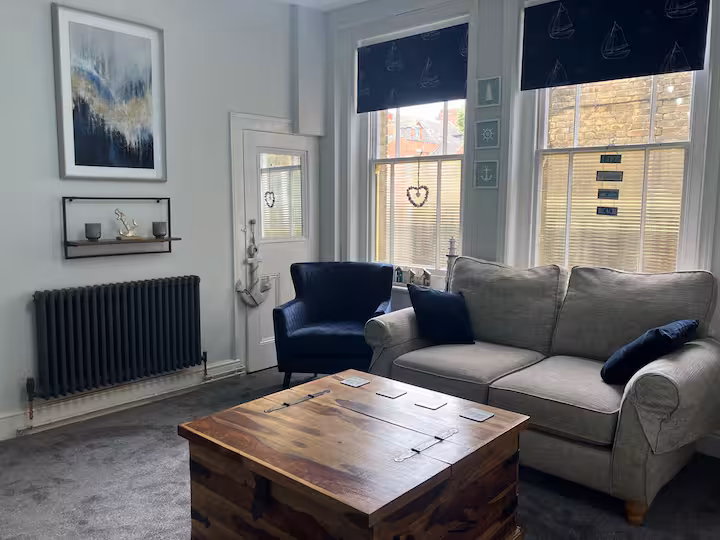 The main room as a living room, with the double pull-down bed put away